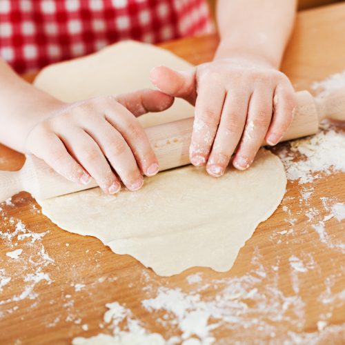Little girl making the dough